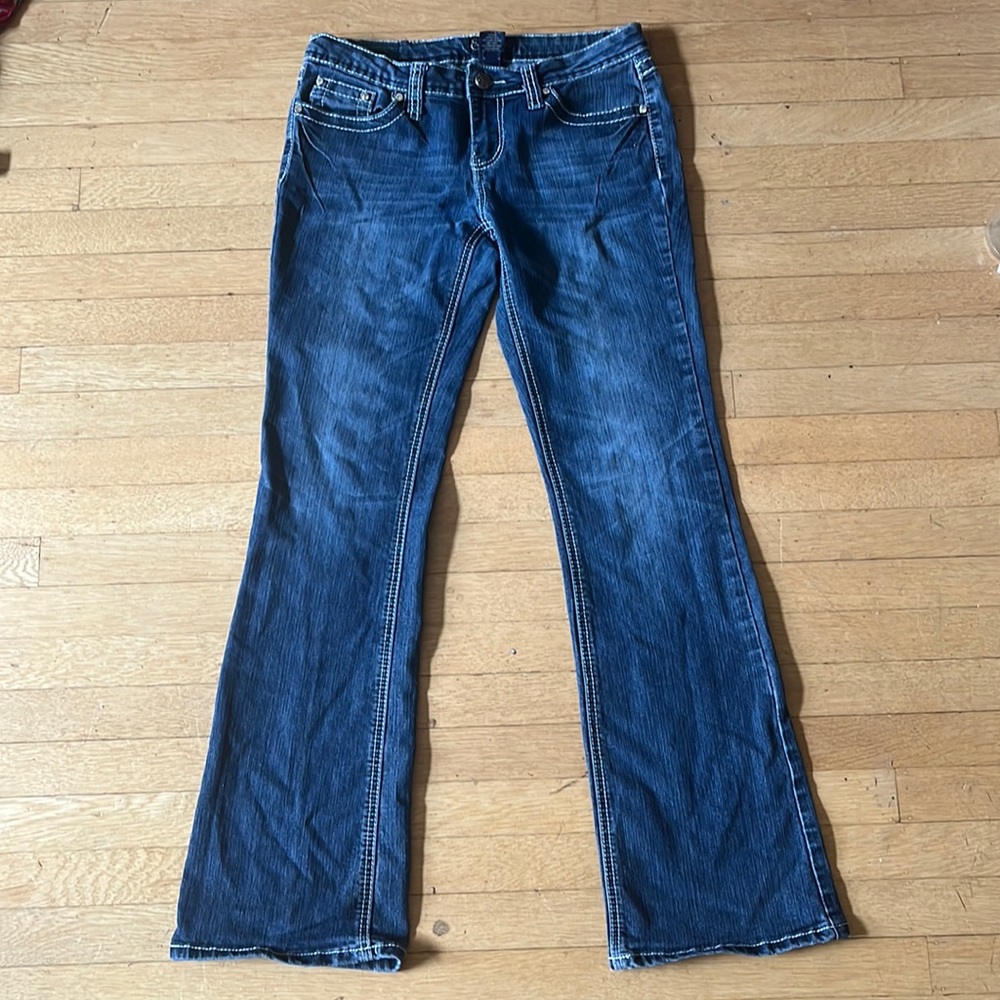 Earl Jeans dark wash boot cut womens lowrise, with designs on back pocket.